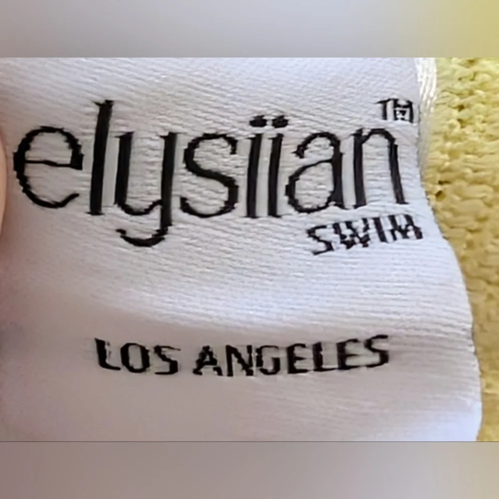 Elysiian Balboa  • thin strap one piece in pastel yellow READ/STAINS